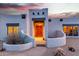 Charming home featuring desert landscaping, unique architectural details, and a warm, inviting entrance at 37646 N Dream St, Carefree, AZ 85377