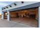 Spacious three-car garage with two doors, concrete floor, and ample storage space at 37646 N Dream St, Carefree, AZ 85377