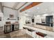 Stylish kitchen with granite countertops, a wine fridge, and island seating at 37646 N Dream St, Carefree, AZ 85377