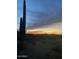Dark desert landscape silhouette at sunset, with saguaro cacti against the backdrop of the dusky, colorful sky at 37646 N Dream St, Carefree, AZ 85377