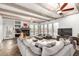 Spacious living room with high ceilings, exposed beams, fireplace, and large windows at 37646 N Dream St, Carefree, AZ 85377