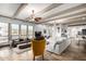 Open-concept living room with tile floors, a fireplace, and ample seating areas at 37646 N Dream St, Carefree, AZ 85377