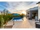 Relaxing backyard featuring a refreshing pool, patio area, and desert views at 37646 N Dream St, Carefree, AZ 85377