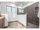 Modern shower with glass doors, gray tile surround, and recessed niche at 37646 N Dream St, Carefree, AZ 85377