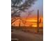 Stunning sunset over desert landscape, featuring saguaro cacti and vibrant colors painting the evening sky at 37646 N Dream St, Carefree, AZ 85377