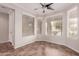 Dining nook featuring tile floor, ceiling fan and multiple windows at 38167 W Santa Clara Ave, Maricopa, AZ 85138
