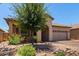Charming single-story home with a xeriscaped front yard and mature tree at 38167 W Santa Clara Ave, Maricopa, AZ 85138