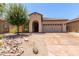 Single-story home featuring a neutral color palette and a well-maintained front yard at 38167 W Santa Clara Ave, Maricopa, AZ 85138