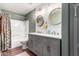 Stylish bathroom featuring double vanity, round mirrors, bath tub and tiled walls at 3830 E Lakewood E Pkwy # 2042, Phoenix, AZ 85048
