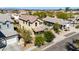 Two-story home in a residential area showcasing the driveway, mature trees, and neighborhood layout at 3914 E Constance Way, Phoenix, AZ 85042