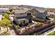 Private backyard with a covered patio, green lawn, mature trees, and lush flowering bushes at 3914 E Constance Way, Phoenix, AZ 85042