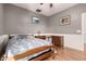 Charming bedroom featuring hardwood floors, paneled walls, desk, and a well-lit area at 3914 E Constance Way, Phoenix, AZ 85042