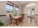 Bright dining room with natural light and a view to the outdoors at 3914 E Constance Way, Phoenix, AZ 85042