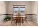 Charming dining room with a wooden table set and view to the outdoors at 3914 E Constance Way, Phoenix, AZ 85042