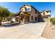 Beautiful two-story home featuring a covered porch with stone accents and a spacious driveway at 3914 E Constance Way, Phoenix, AZ 85042