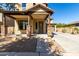 Charming home entrance with stone pillar accents and desert landscaping at 3914 E Constance Way, Phoenix, AZ 85042