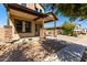 Attractive covered front porch with decorative stone pillars and desert landscaping at 3914 E Constance Way, Phoenix, AZ 85042