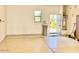 A spacious three car garage with epoxy flooring and a utility room and water softener system at 3914 E Constance Way, Phoenix, AZ 85042