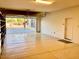 Three car garage featuring built in shelving, epoxy flooring, and a garage door to exterior at 3914 E Constance Way, Phoenix, AZ 85042
