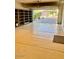 View of a spacious three car garage with epoxy flooring and built in shelving units at 3914 E Constance Way, Phoenix, AZ 85042