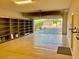 A spacious three car garage with epoxy flooring, built in shelving, and a roll up garage door at 3914 E Constance Way, Phoenix, AZ 85042