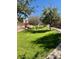 Lush community green space with walking path, perfect for leisurely strolls and enjoying outdoor activities at 3914 E Constance Way, Phoenix, AZ 85042