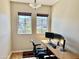 Bright home office with dual monitors and an ergonomic chair offering a comfortable workspace at 3914 E Constance Way, Phoenix, AZ 85042