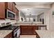 Modern kitchen with stainless steel appliances and granite countertops at 3914 E Constance Way, Phoenix, AZ 85042