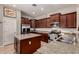 Modern kitchen with stainless steel appliances, granite countertops, and ample cabinet space at 3914 E Constance Way, Phoenix, AZ 85042