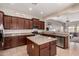 Spacious kitchen with stainless appliances, granite counters, and an open layout to the living area at 3914 E Constance Way, Phoenix, AZ 85042