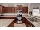 Well-equipped kitchen featuring stainless steel appliances and granite countertops at 3914 E Constance Way, Phoenix, AZ 85042