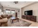 Spacious living room with neutral paint, tile flooring, and a comfortable seating arrangement at 3914 E Constance Way, Phoenix, AZ 85042