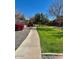 Picturesque community path through lush green space, creating a serene environment for walking and relaxation at 3914 E Constance Way, Phoenix, AZ 85042