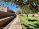 Scenic community walking path lined with green space, ideal for exercise and enjoying nature at 3914 E Constance Way, Phoenix, AZ 85042