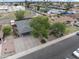 Aerial view of a well-maintained home with mature landscaping and a spacious driveway at 3931 W Augusta Ave, Phoenix, AZ 85051