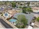 Aerial view featuring a backyard pool, covered patio, and manicured landscaping at 3931 W Augusta Ave, Phoenix, AZ 85051