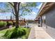 Landscaped backyard featuring a comfortable bench and an inviting pool at 3931 W Augusta Ave, Phoenix, AZ 85051