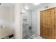 Stylish bathroom with a walk-in shower, tiled walls, and modern fixtures at 3931 W Augusta Ave, Phoenix, AZ 85051