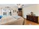 Cozy bedroom with a view of the pool through glass doors and a dresser at 3931 W Augusta Ave, Phoenix, AZ 85051