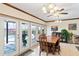 Bright dining room with pool view, featuring wooden table, chairs, and sliding glass doors at 3931 W Augusta Ave, Phoenix, AZ 85051