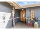 Inviting entryway featuring a stylish wooden door, brick accents, and welcoming decor at 3931 W Augusta Ave, Phoenix, AZ 85051