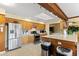 Open kitchen featuring stainless steel appliances, light wood cabinetry, and a bright skylight at 3931 W Augusta Ave, Phoenix, AZ 85051