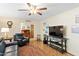 Comfortable living room with wood floors, ceiling fan, and a cozy seating arrangement at 3931 W Augusta Ave, Phoenix, AZ 85051