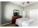 Bedroom with a dresser, TV, and a sliding door closet at 41961 W Centennial Rd, Maricopa, AZ 85138