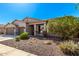 Charming single-story home showcasing a well-maintained front yard and an attached two-car garage at 41961 W Centennial Rd, Maricopa, AZ 85138