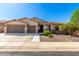 Charming single-story home showcasing a well-maintained front yard and an attached two-car garage at 41961 W Centennial Rd, Maricopa, AZ 85138