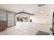 Spacious garage with an open door revealing the front of the house at 41961 W Centennial Rd, Maricopa, AZ 85138