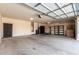 Garage interior with ample space, storage racks, and utility connections at 41961 W Centennial Rd, Maricopa, AZ 85138
