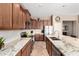 Bright kitchen with granite countertops, stainless steel appliances, and ample cabinet space at 41961 W Centennial Rd, Maricopa, AZ 85138