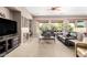 Comfortable living room with fireplace, natural light and plush seating at 41961 W Centennial Rd, Maricopa, AZ 85138